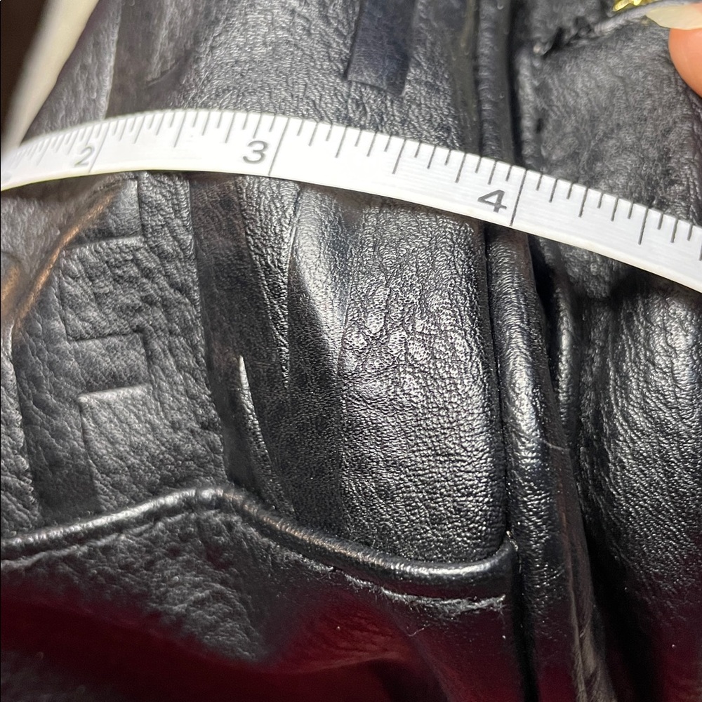 Steve Madden Embossed Black Backpack with Gold Details - Picture 12 of 13